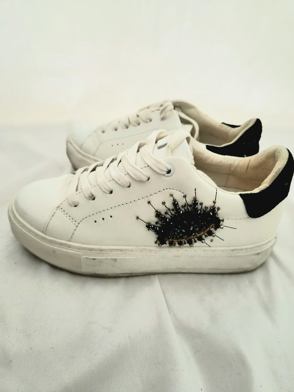Kurt Geiger White Low-Top Sneakers with Black Heel and Embellishment